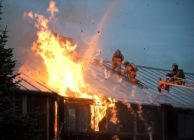 Firefighters putting out a house fire